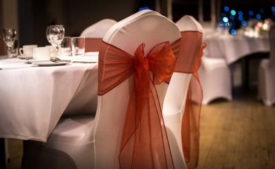 An image of a chair with a ribbon on the back